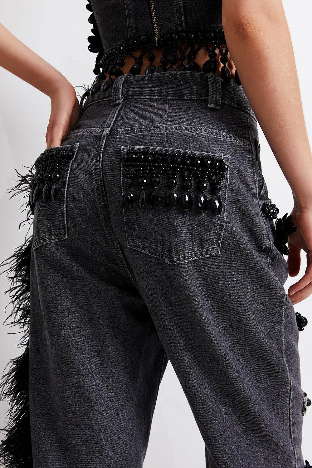 HAND-BEADED JEANS WITH FEATHER TRIM