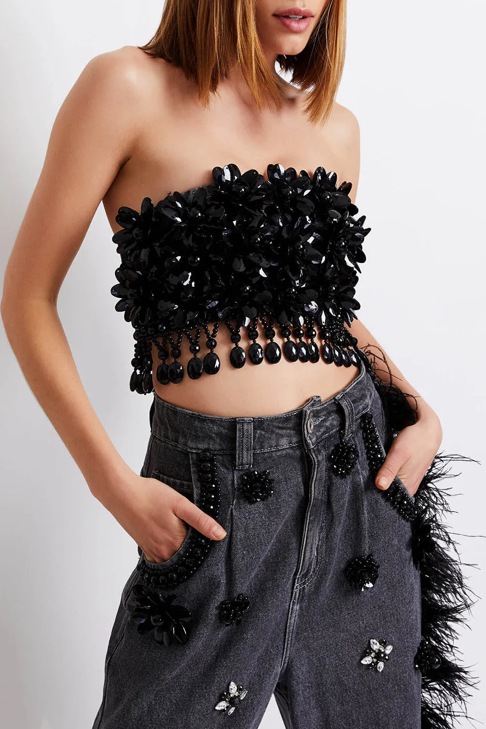 HAND-BEADED JEANS WITH FEATHER TRIM
